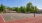 Outdoor basketball court with trees